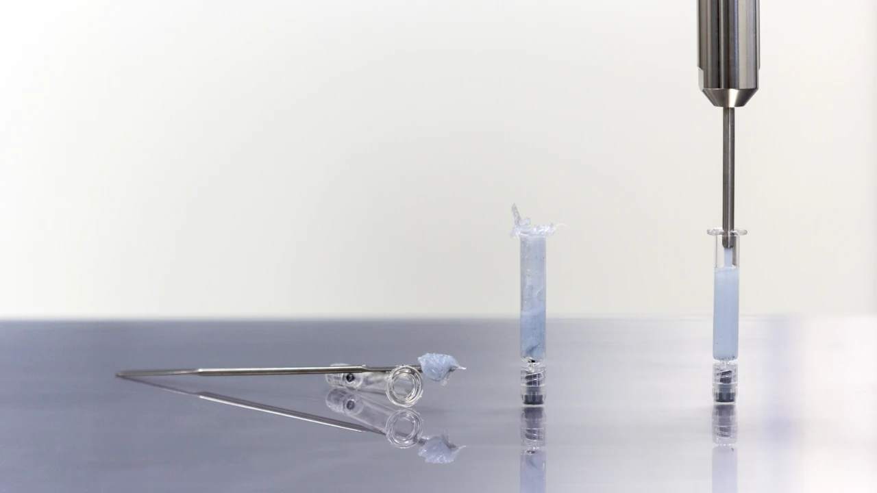 Filling semi-solid pharamceutical products cleanly and gently into dosing syringes